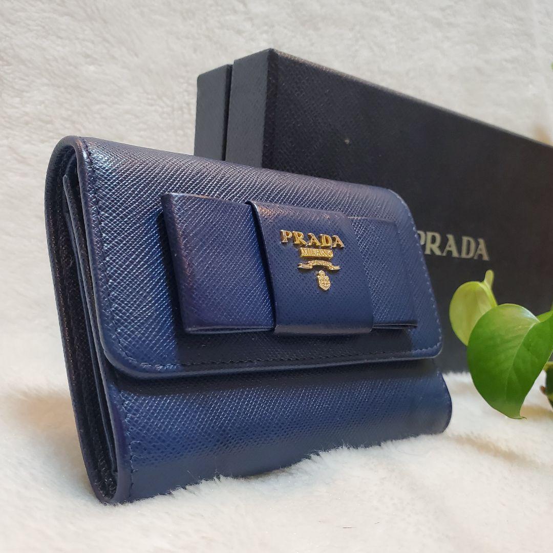 美品　PRADA 折り財布 サフィアーノ メタルロゴ リボン ブルー