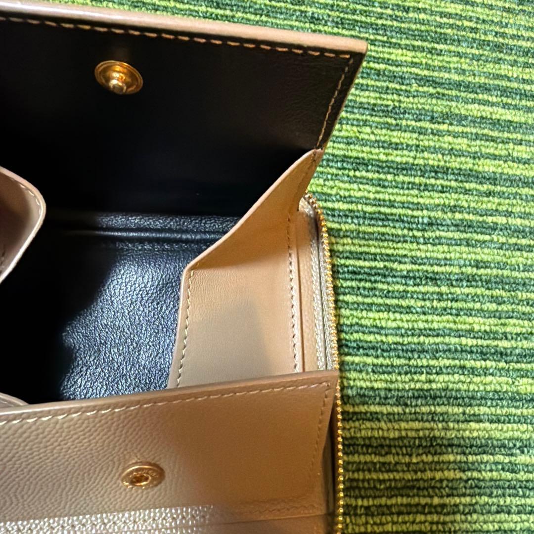 イヴ・サンローラン　YSL ベージュ キルティング 二つ折り財布