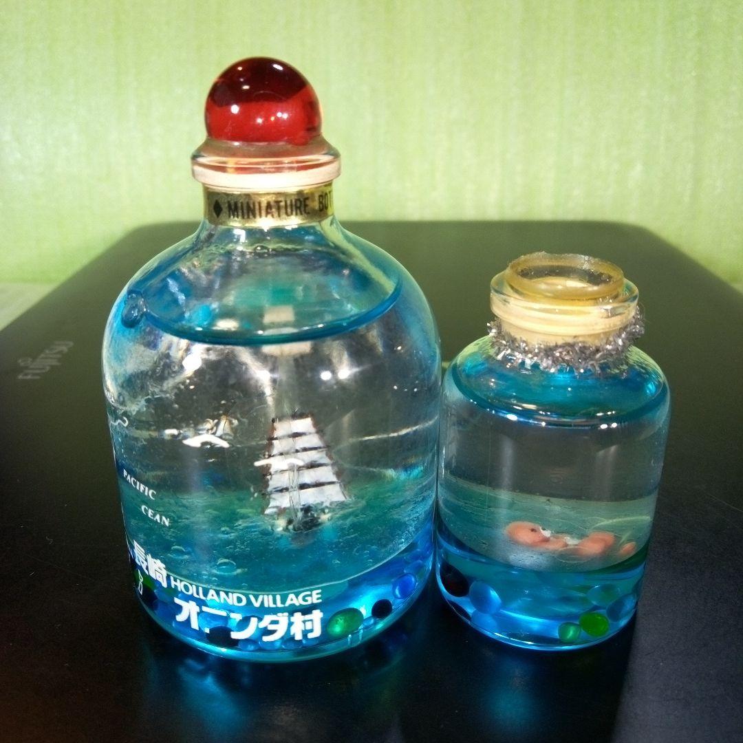 ①黒船　長崎オランダ村　ミニチュアボトル　②ラッコ　オイルドーム　①②セット